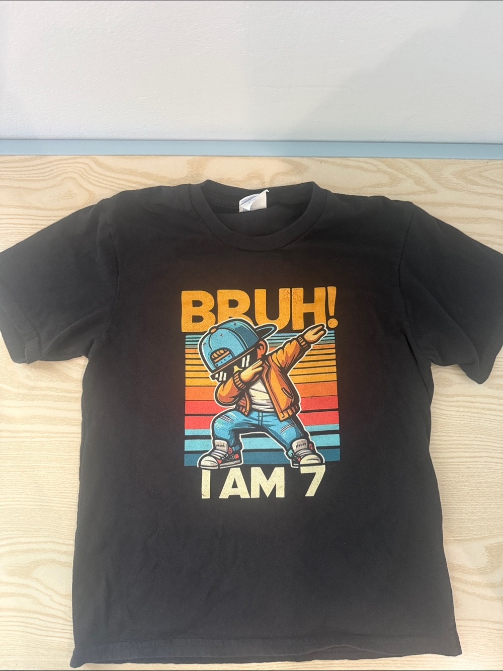 Bruh! I Am 7 Graphic Tee - Black with Retro Orange & Blue Print